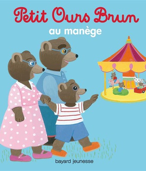 PETIT OURS BRUN AU MANEGE
